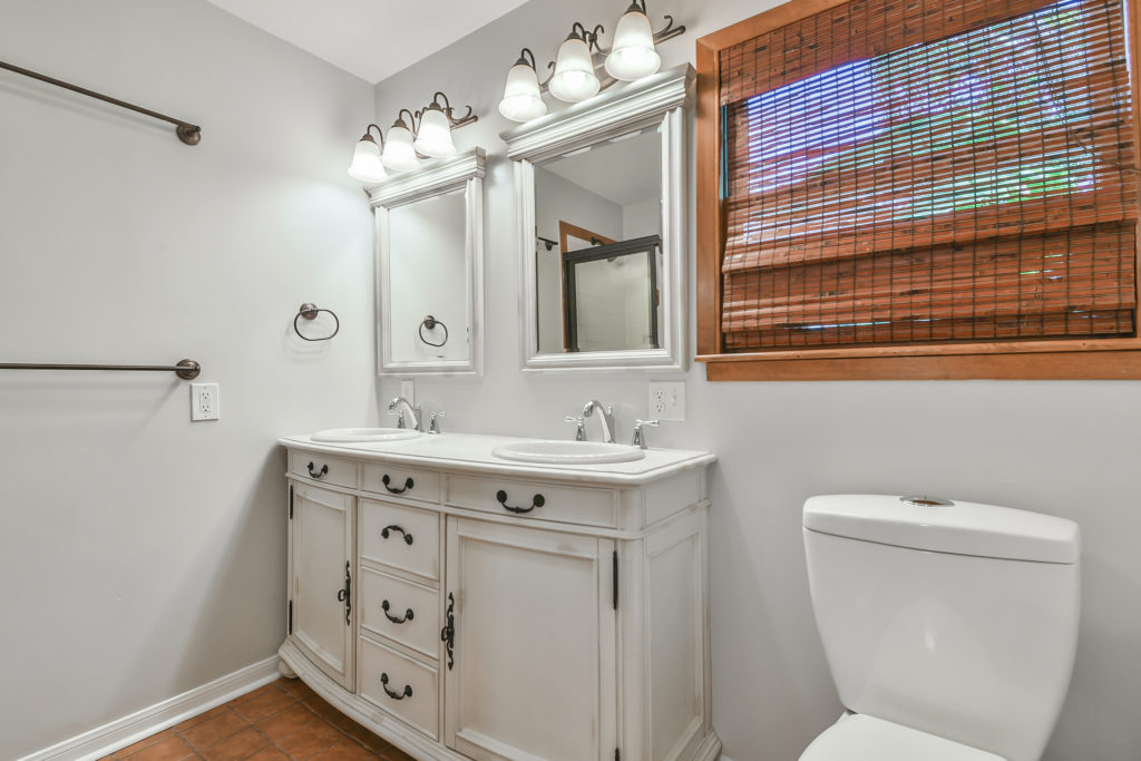 En suite master bathroom with double vanity.